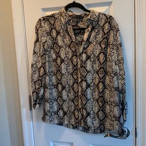 Women’s long sleeve, snake skin pattern, soft button blouse.